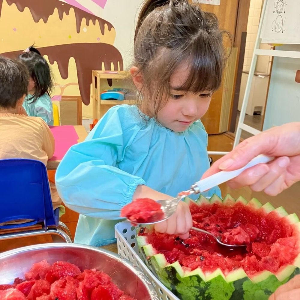 Enjoying watermelon at snack time