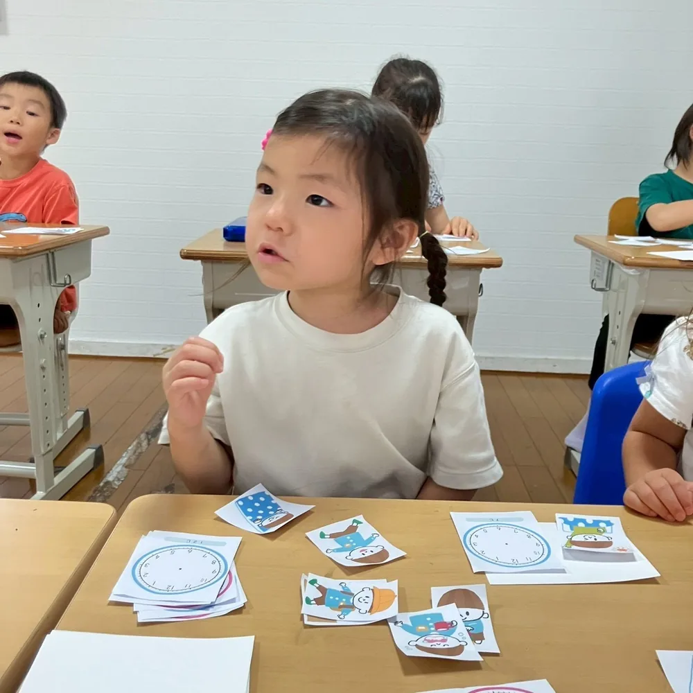 A child engaged in an afternoon lesson
