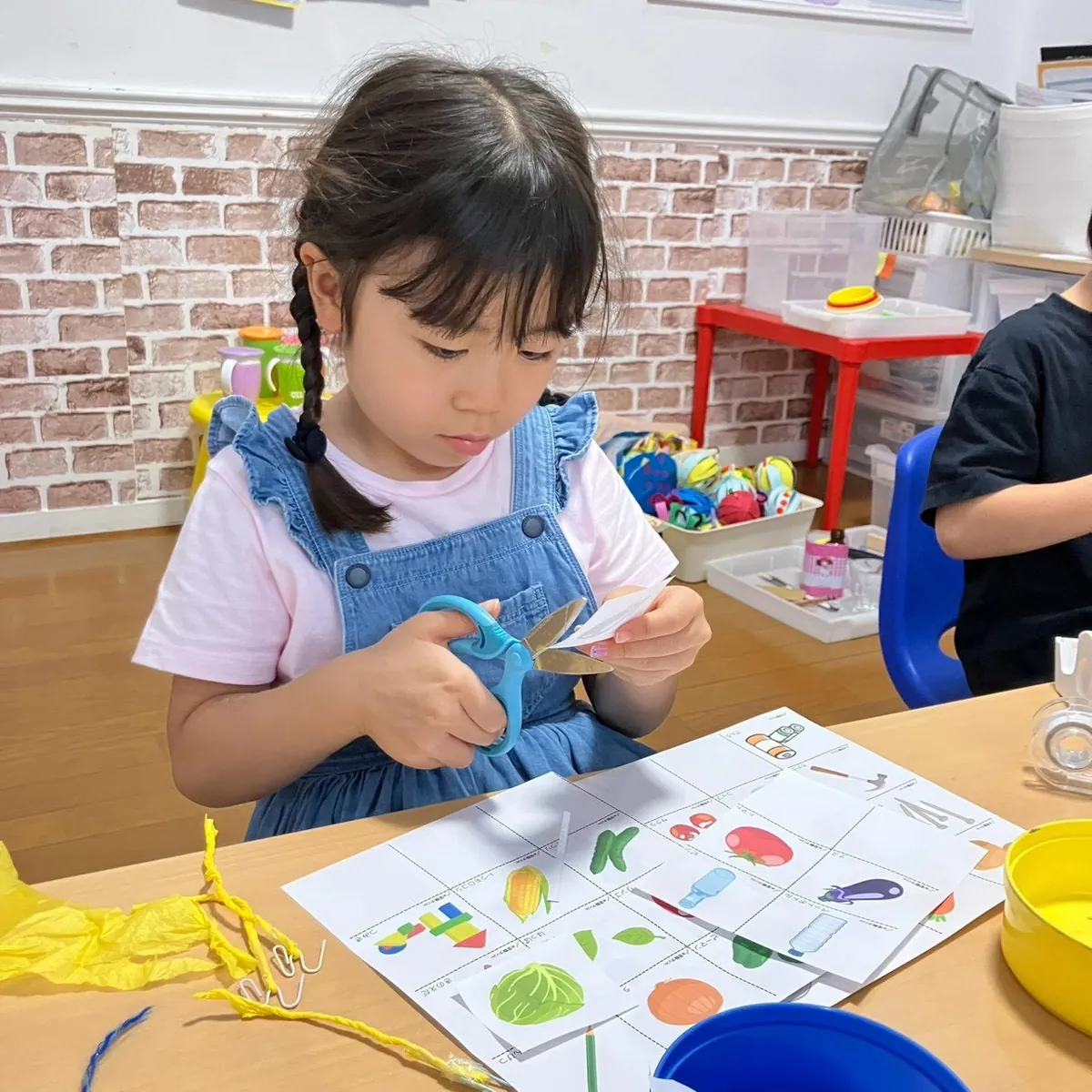A child working on an activity in afternoon classes
