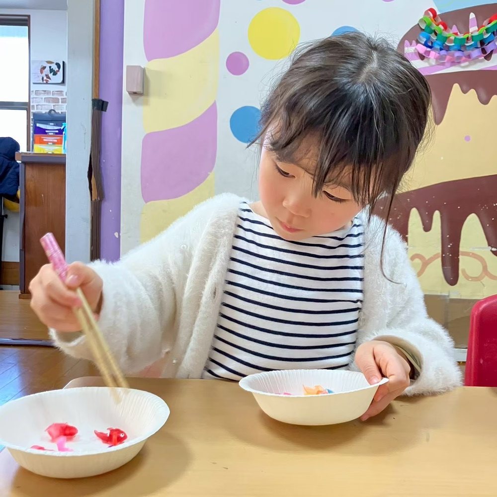 Fine motor practice: picking up beads with chopsticks